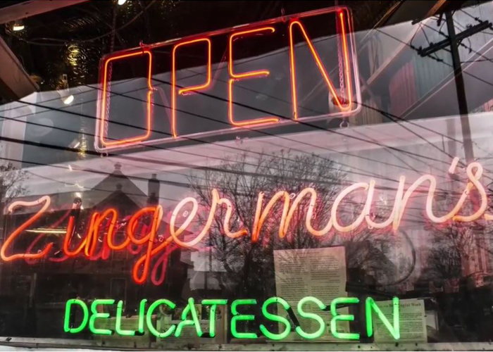 An "open" sign at Zingerman's Deli