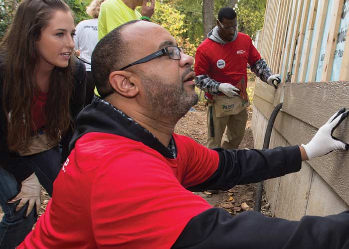Alex Fennoy participates in a Habitat for Humanity build