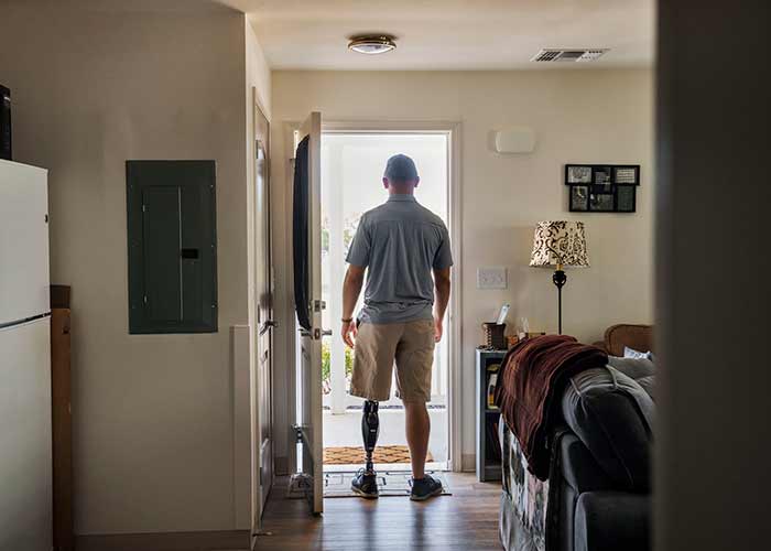 veteran standing in doorway