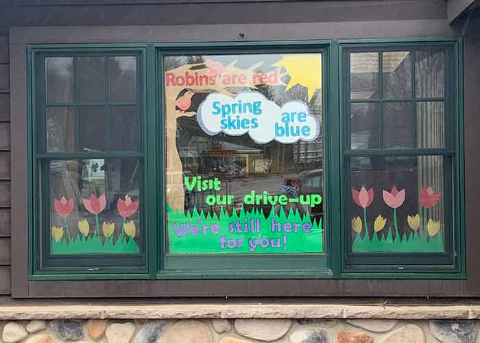 A drive-thru window decorated with Spring decorations