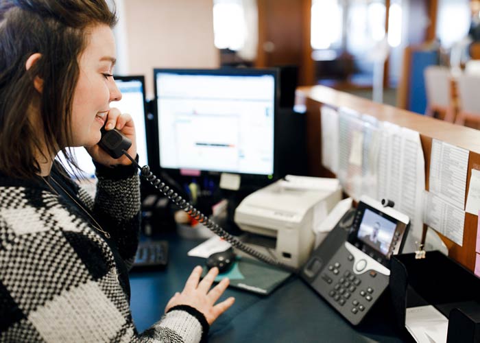 A banker and customer meet through a teleconference