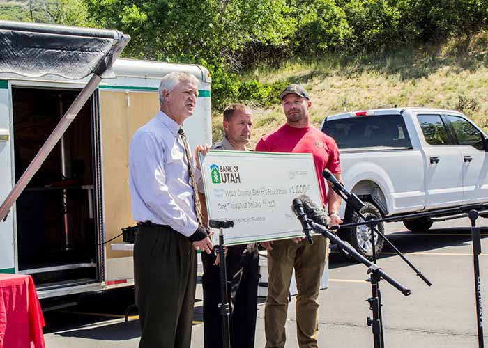 Bank of Utah donated $1,000 towards WCSAR, and kicked off a month long Reach New Heights campaign to raise additional funds for this life-saving technology. 